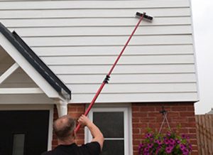 Cleaning house cladding